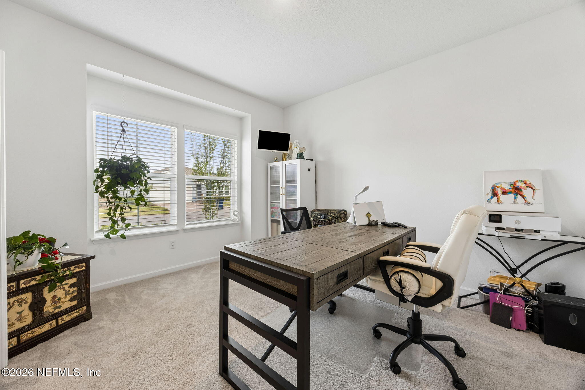 75626 Pondside Lane Yulee, FL 32097 - Photo 12 of 95 a view of a workspace with furniture and a window