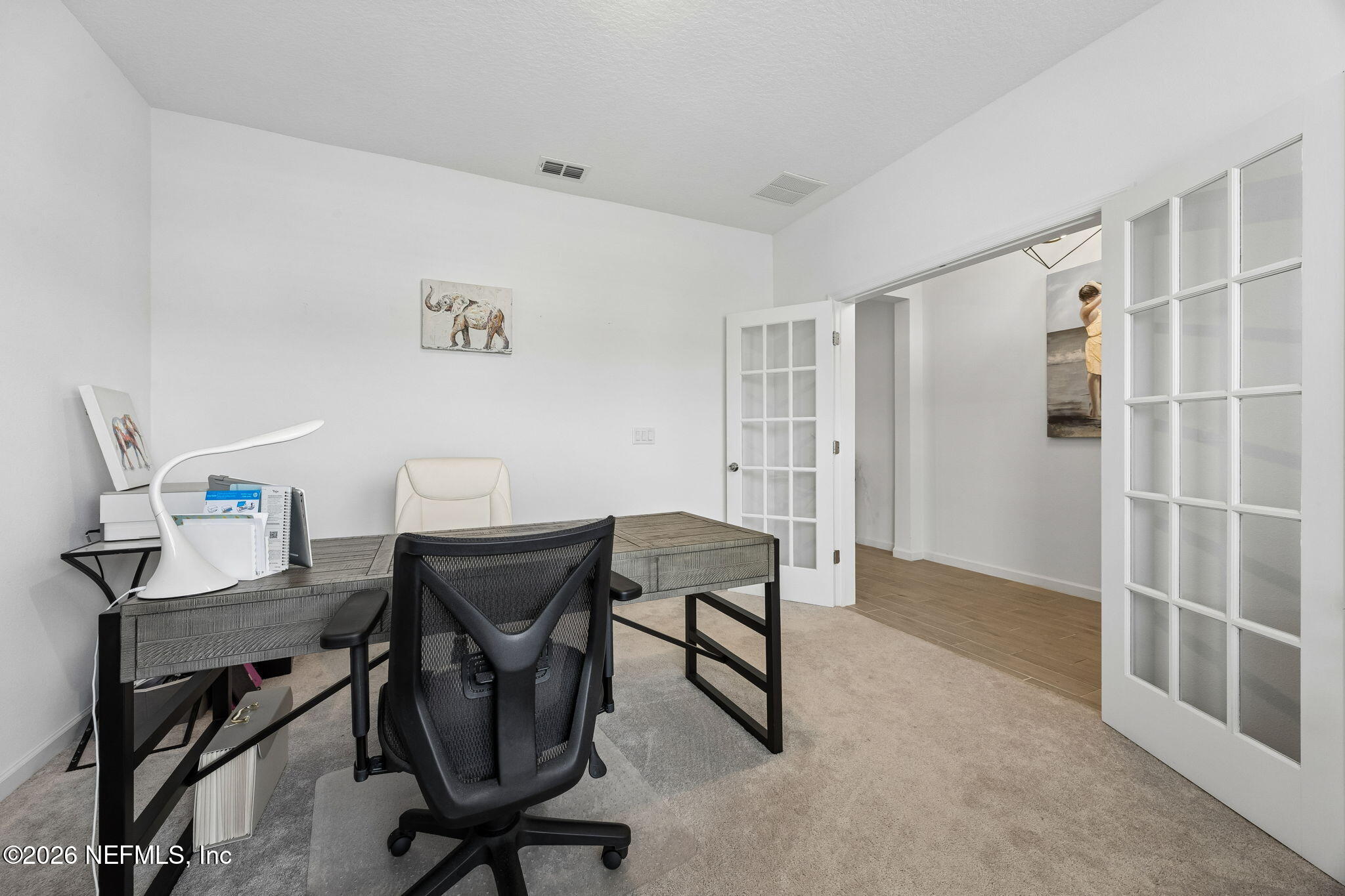 75626 Pondside Lane Yulee, FL 32097 - Photo 14 of 95 a view of a workspace with furniture and a window
