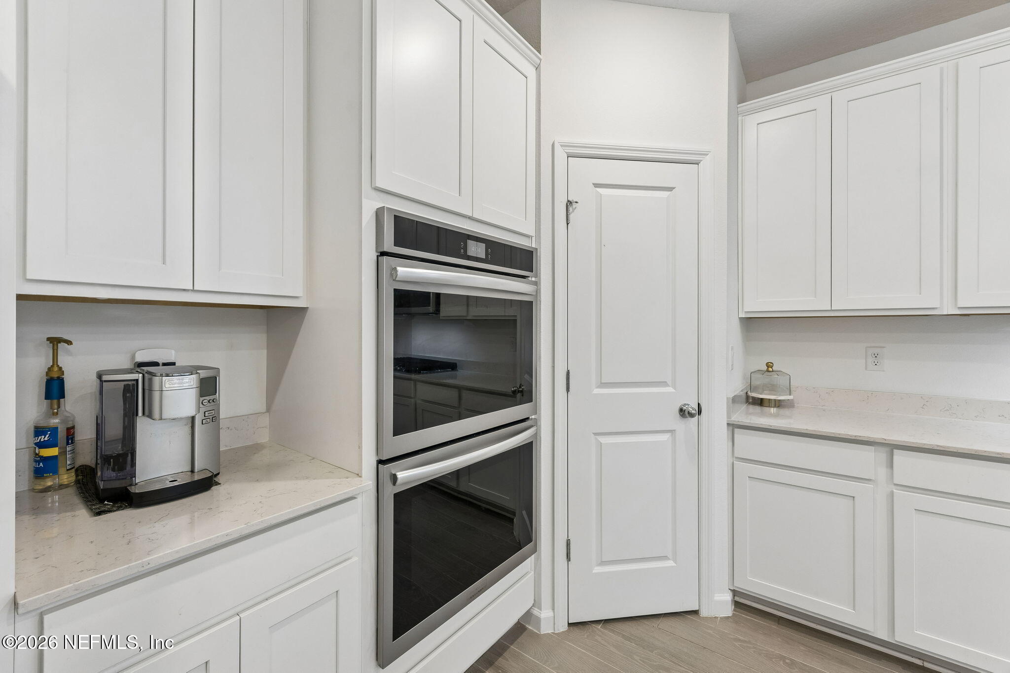 75626 Pondside Lane Yulee, FL 32097 - Photo 19 of 95 a kitchen with cabinets and stainless steel appliances