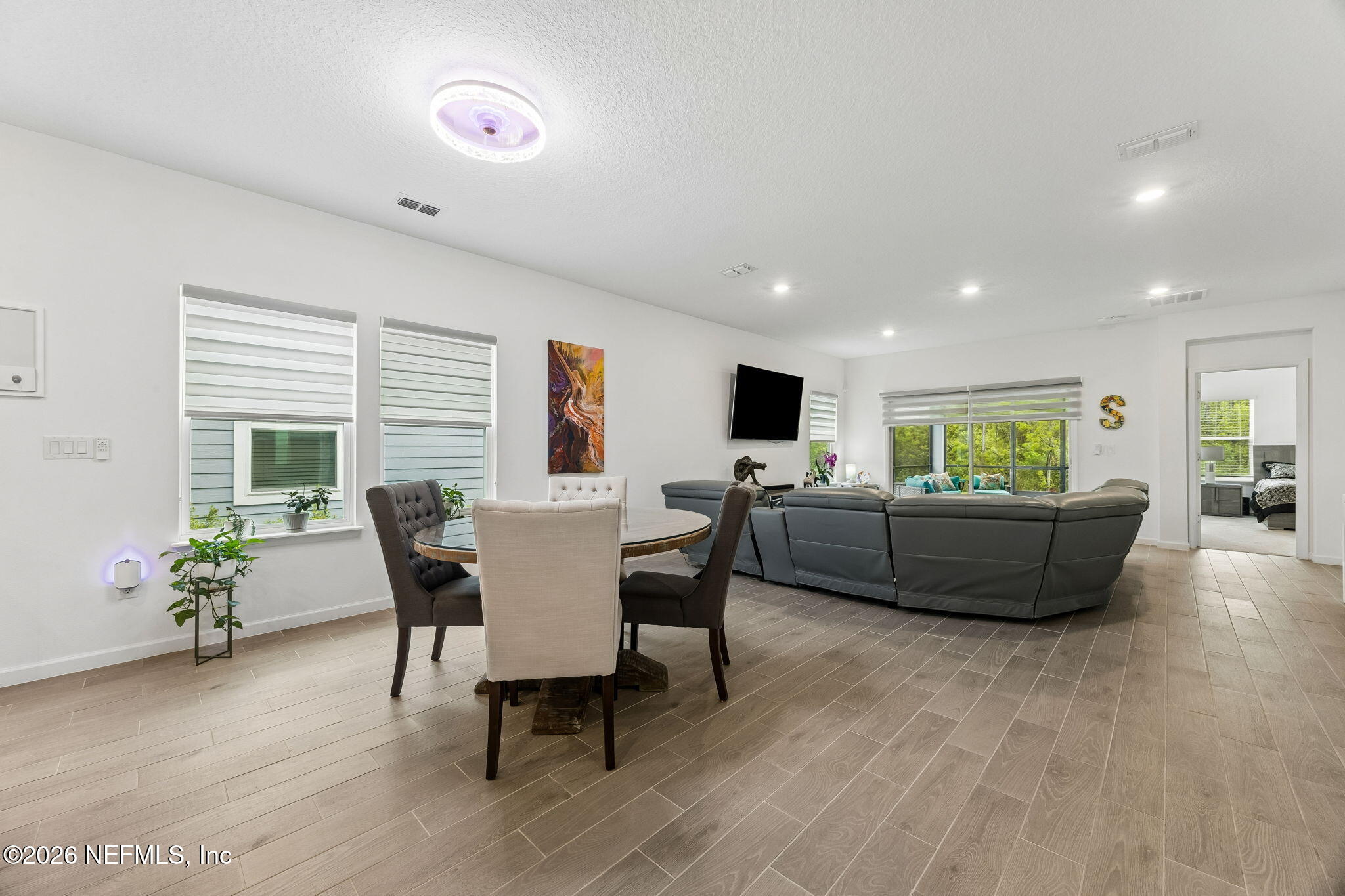 75626 Pondside Lane Yulee, FL 32097 - Photo 22 of 95 a living room with furniture and a wooden floor