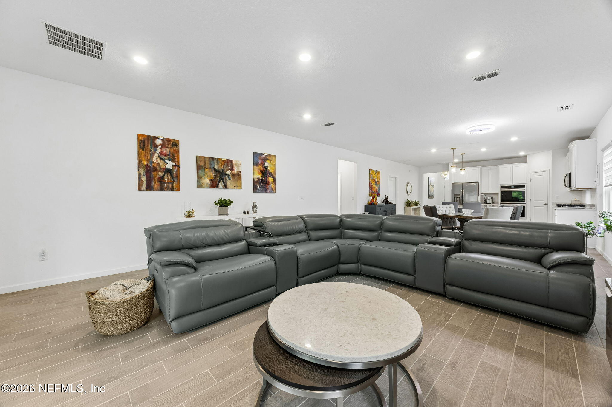 75626 Pondside Lane Yulee, FL 32097 - Photo 26 of 95 a living room with furniture and a wooden floor