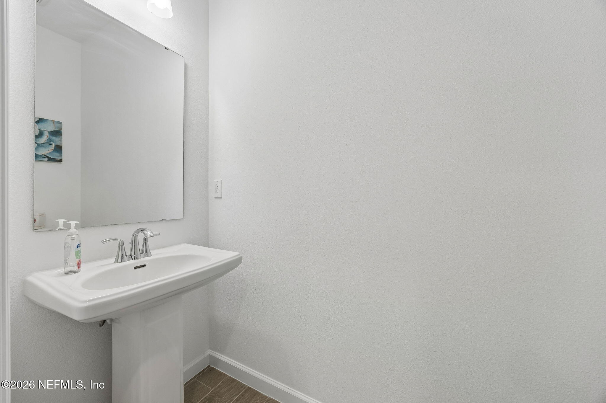 75626 Pondside Lane Yulee, FL 32097 - Photo 27 of 95 a bathroom with a sink and a mirror