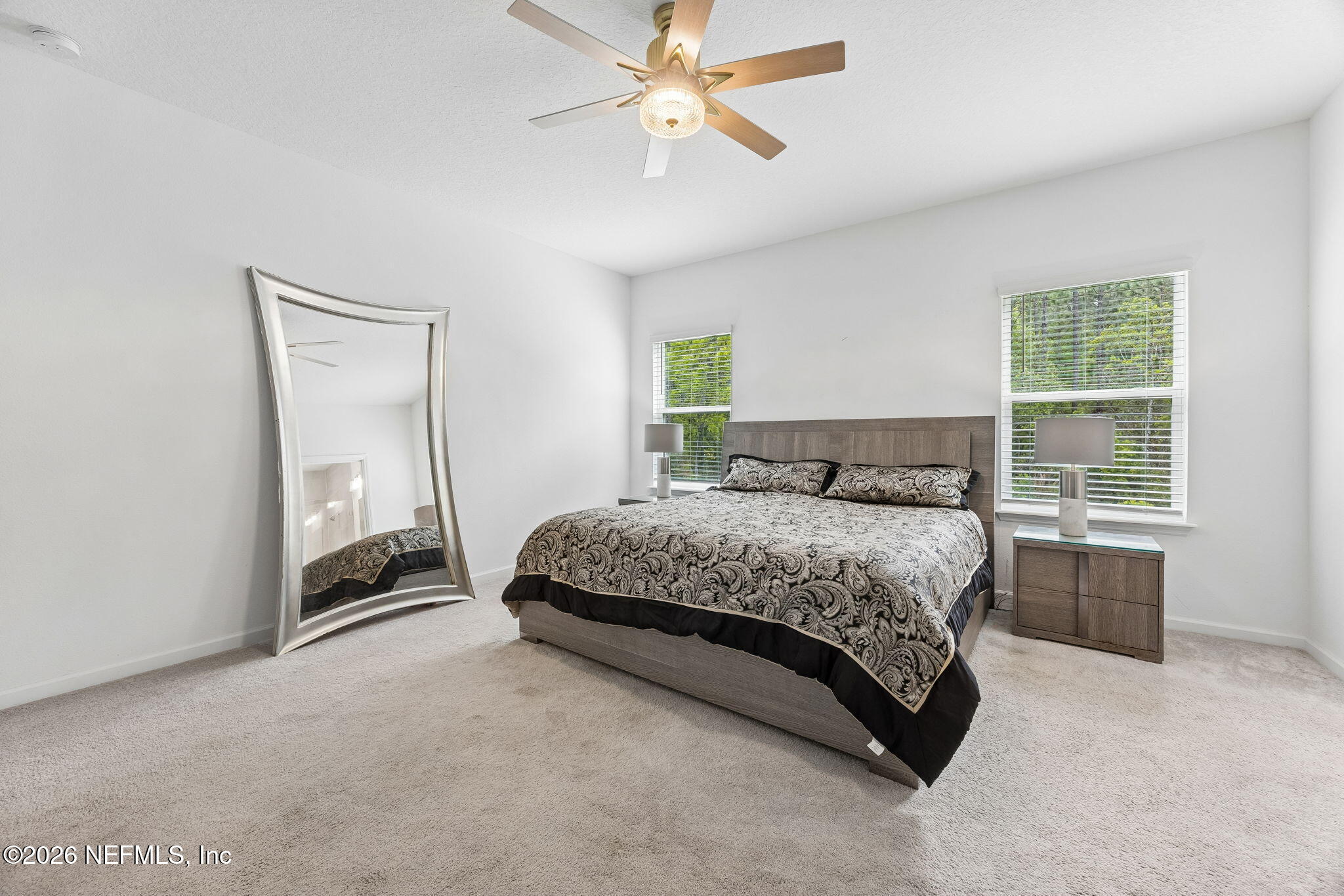 75626 Pondside Lane Yulee, FL 32097 - Photo 30 of 95 a bedroom with a bed and a window