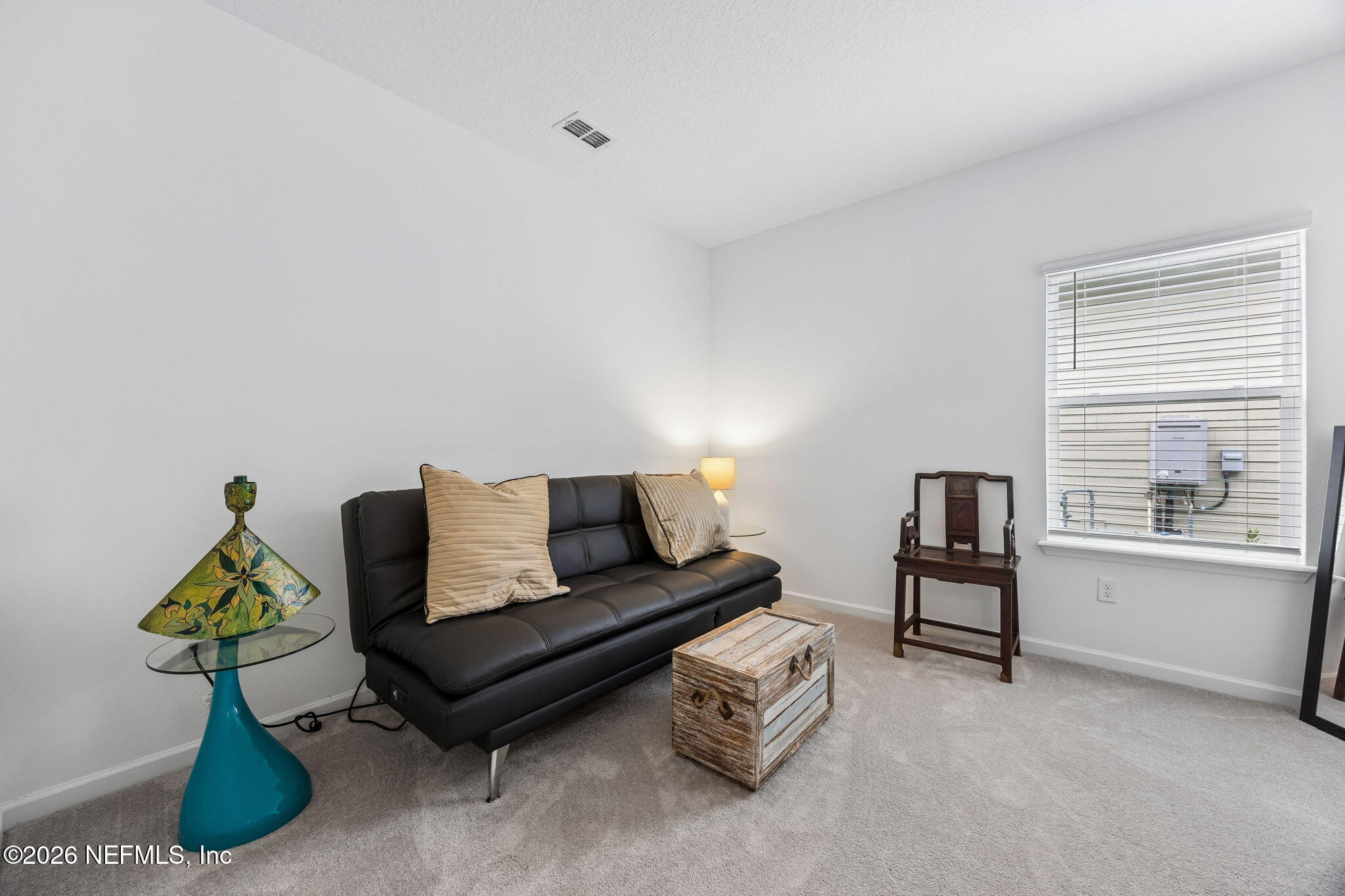 75626 Pondside Lane Yulee, FL 32097 - Photo 36 of 95 a living room with furniture and a window