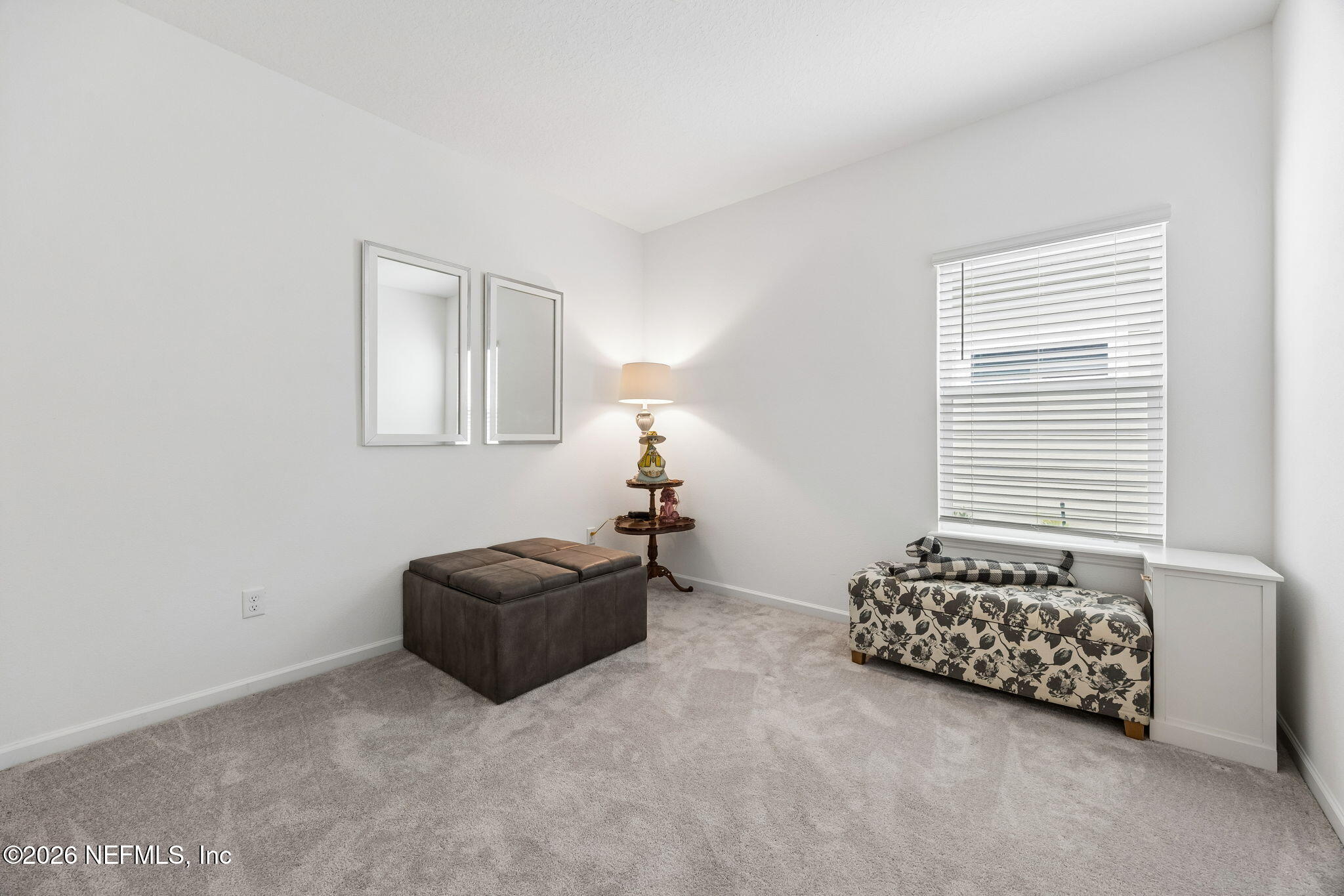 75626 Pondside Lane Yulee, FL 32097 - Photo 45 of 95 a living room with furniture and a window