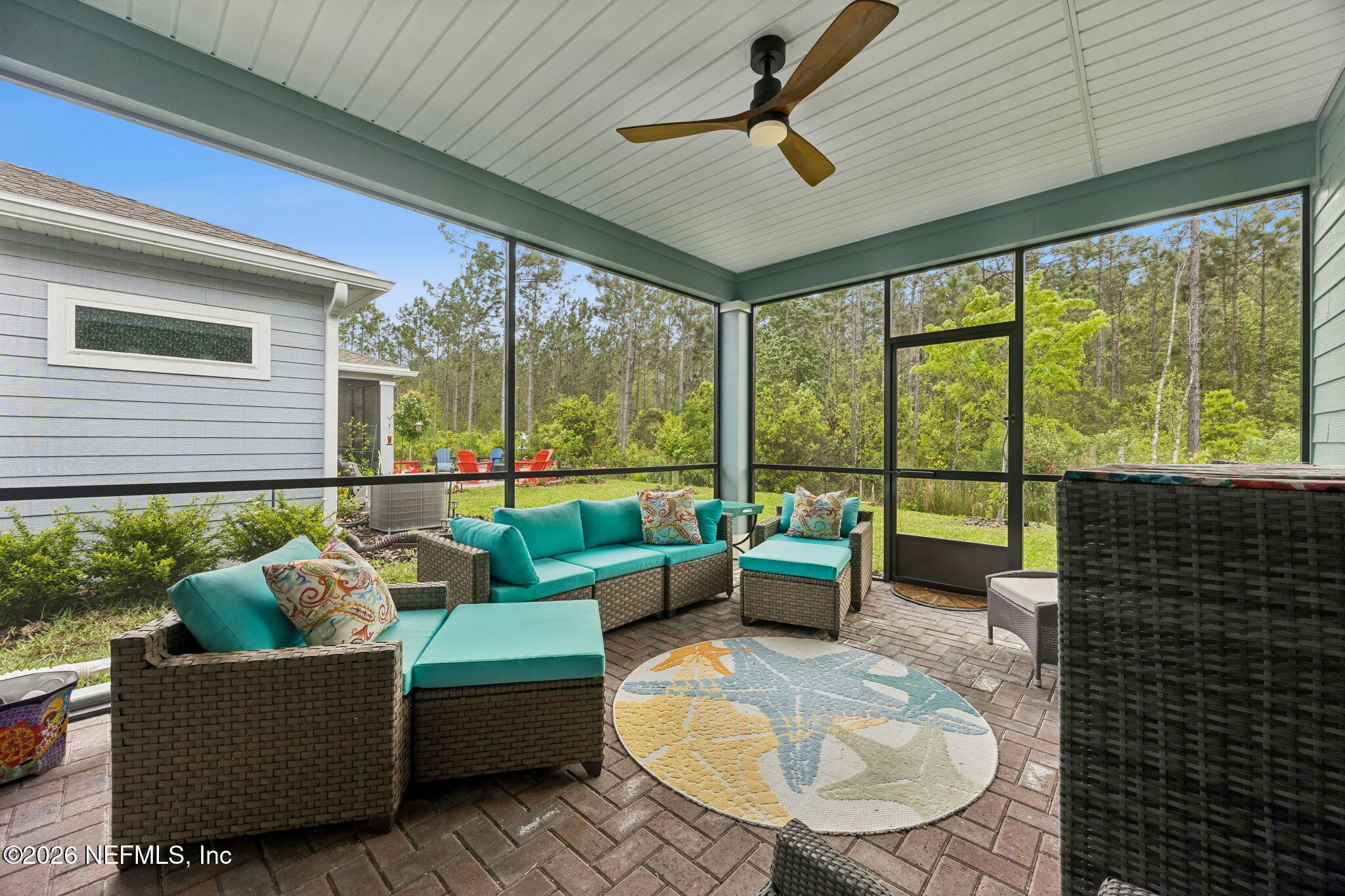 75626 Pondside Lane Yulee, FL 32097 - Photo 49 of 95 a living room with furniture and a large window