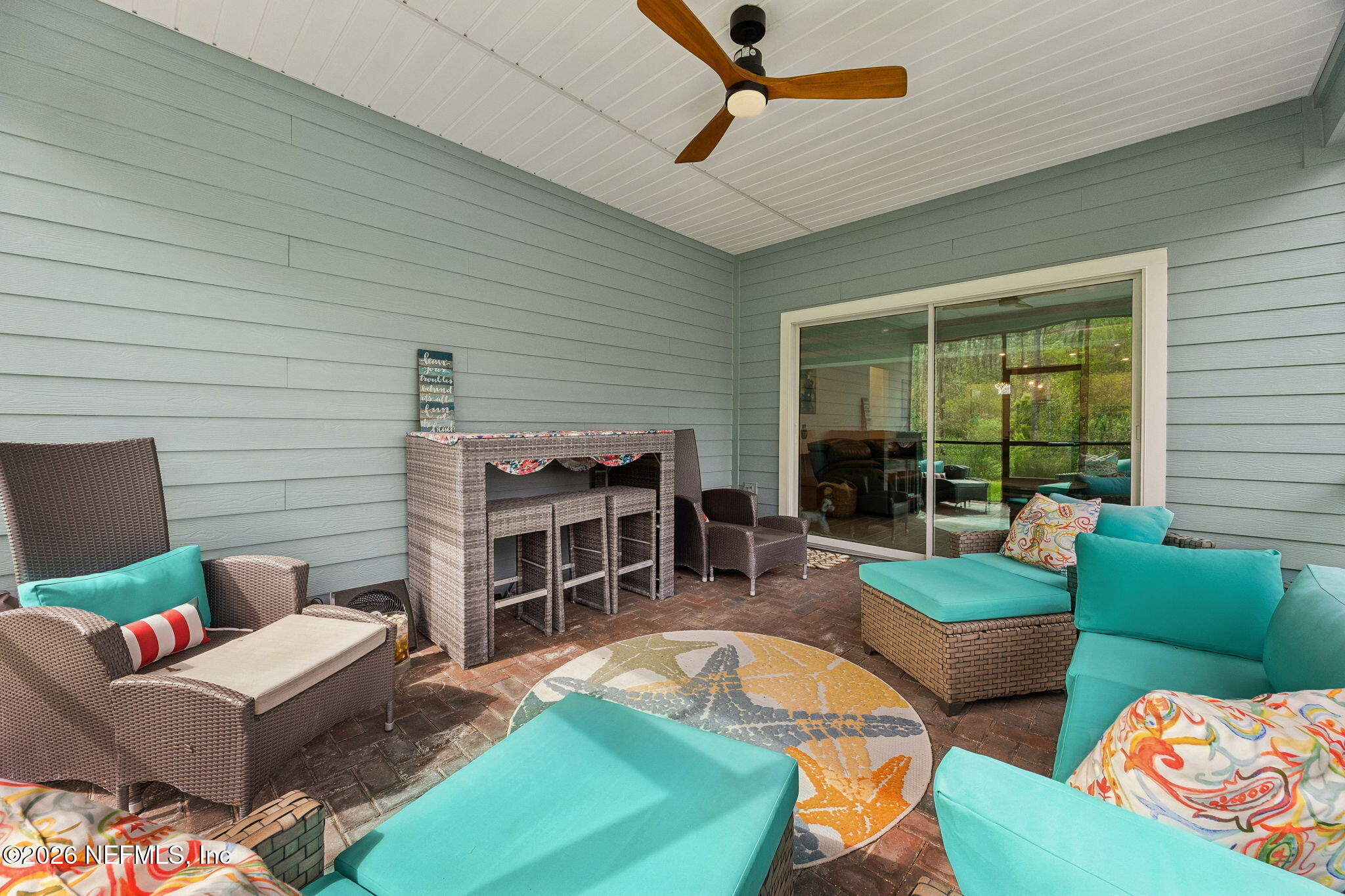 75626 Pondside Lane Yulee, FL 32097 - Photo 53 of 95 a living room with furniture and a large window