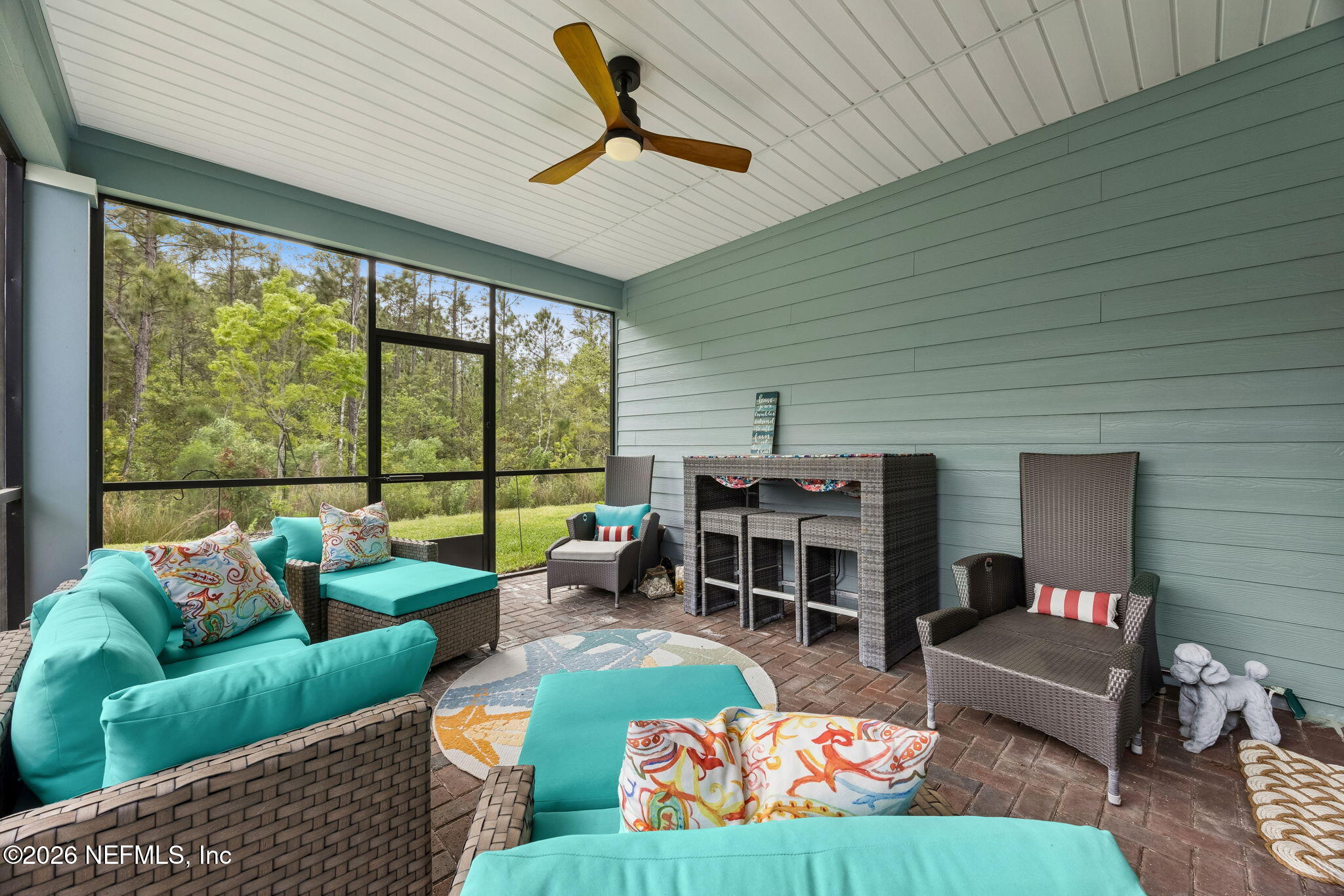 75626 Pondside Lane Yulee, FL 32097 - Photo 6 of 95 a living room with furniture and a large window