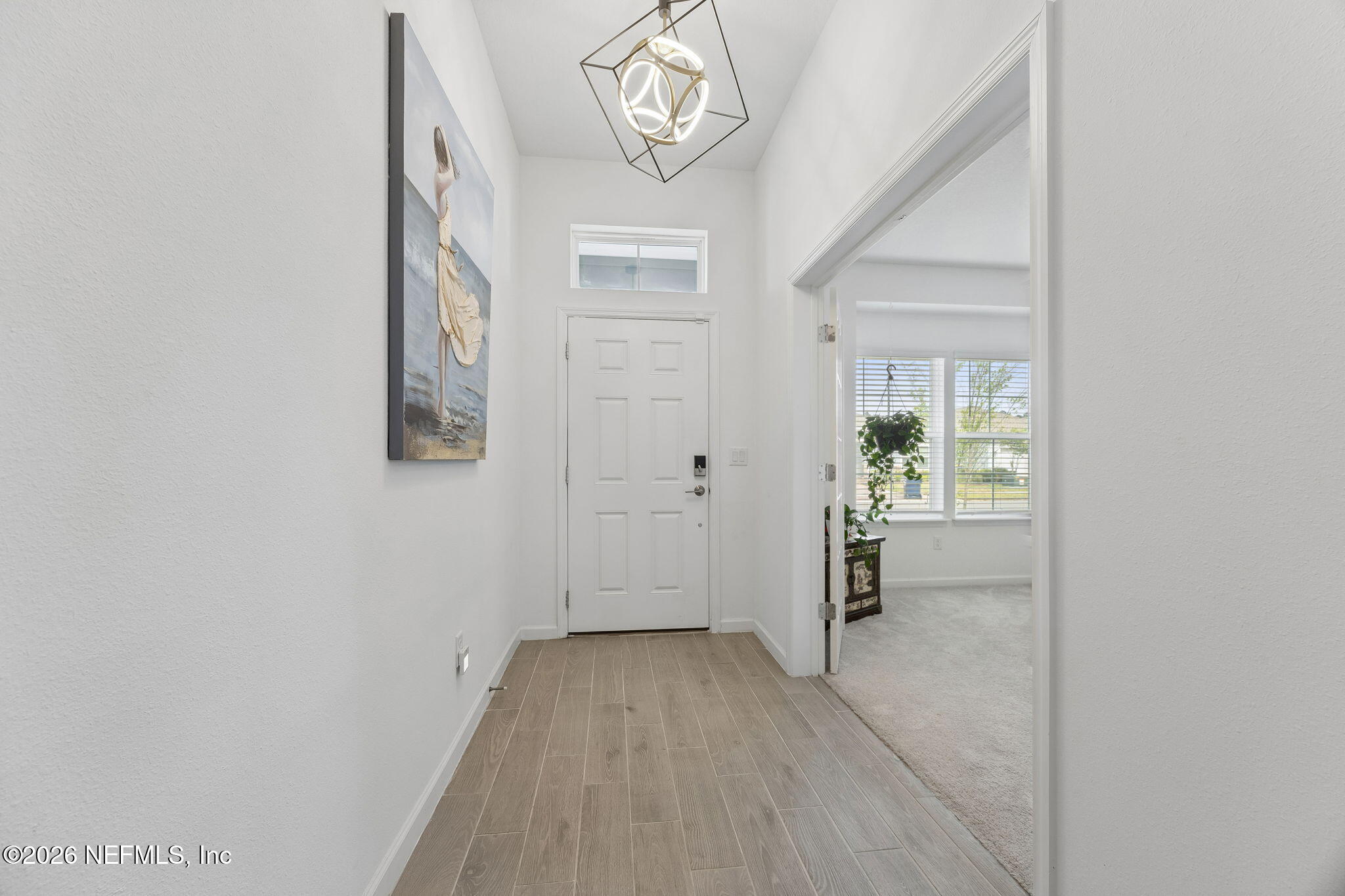 75626 Pondside Lane Yulee, FL 32097 - Photo 10 of 95 a view of an entryway with wooden floor