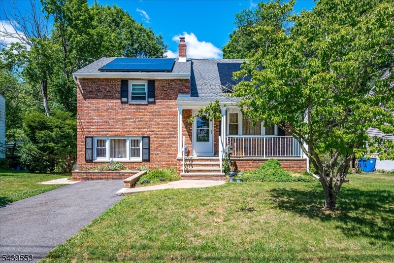 15 Woodmere Street Raritan, NJ 08869 - Photo 2 of 16 a front view of a house with a yard and trees