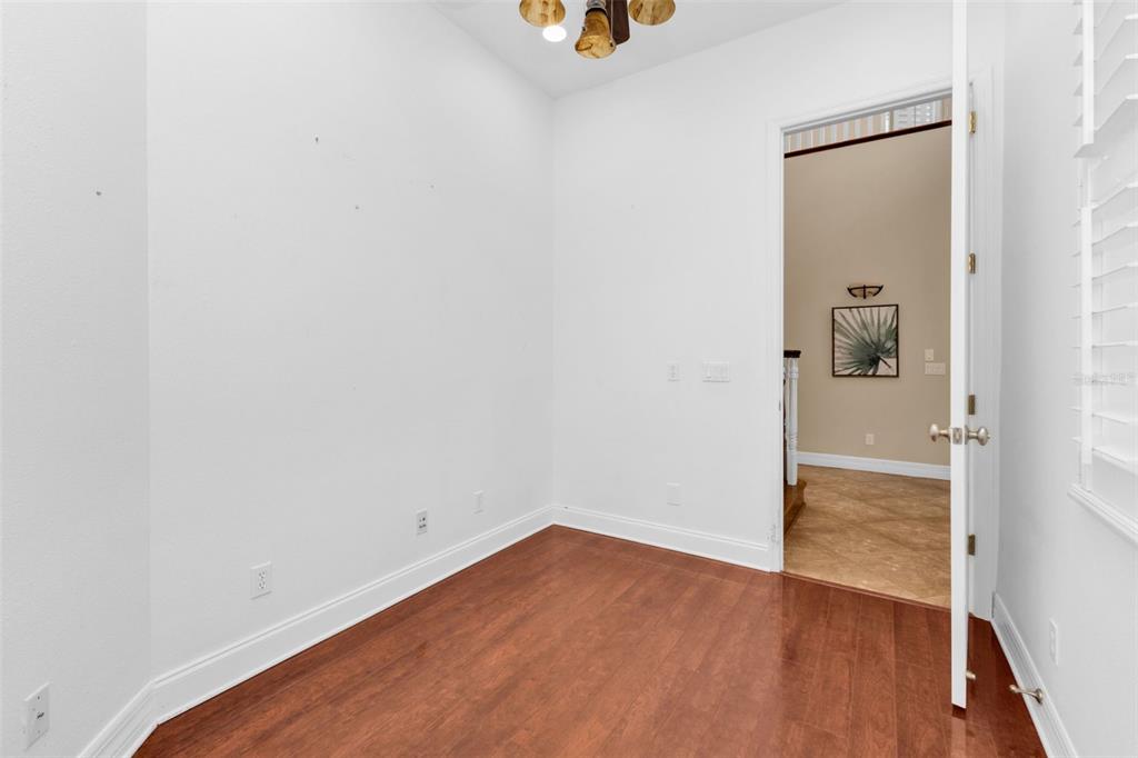 5595 Riverside Drive Punta Gorda, FL 33982 - Photo 12 of 78 a view of a small space with wooden floor sink and closet
