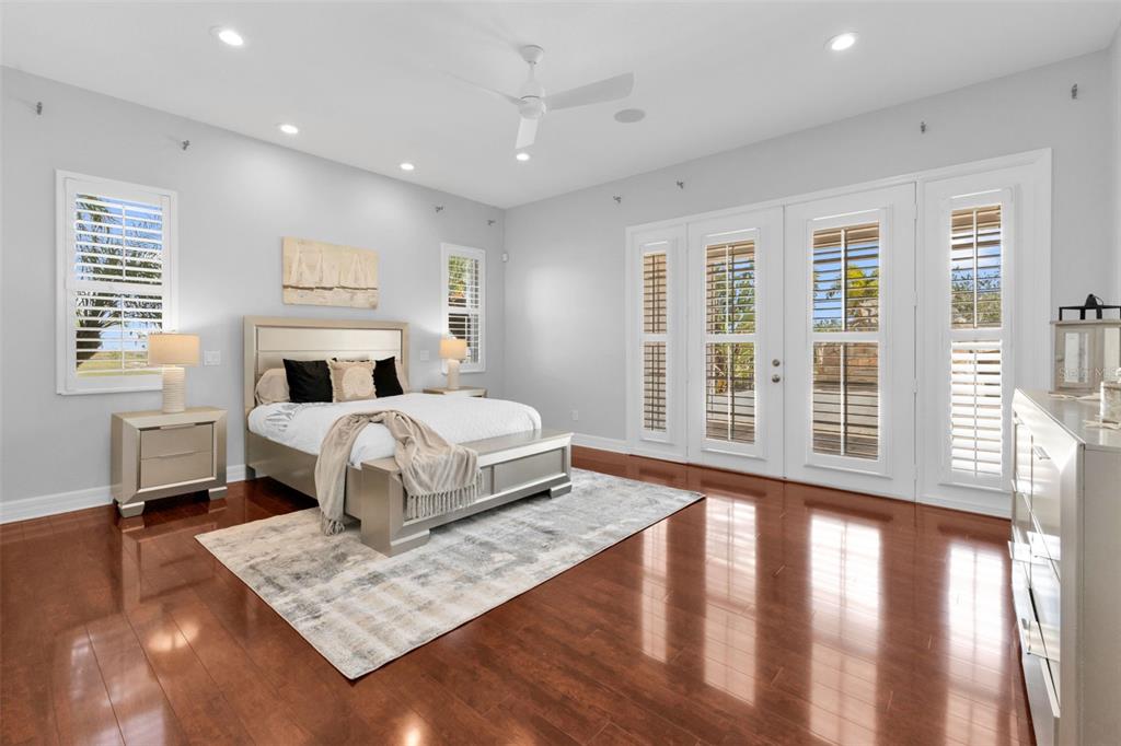 5595 Riverside Drive Punta Gorda, FL 33982 - Photo 28 of 78 a bedroom with a large bed and a window