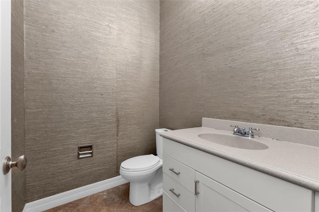 5595 Riverside Drive Punta Gorda, FL 33982 - Photo 35 of 78 a bathroom with a sink a toilet and a mirror