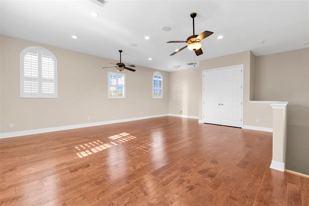 5595 Riverside Drive Punta Gorda, FL 33982 - Photo 38 of 78 a view of an empty room with window and wooden floor