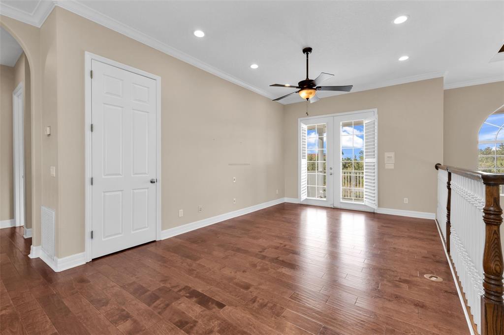 5595 Riverside Drive Punta Gorda, FL 33982 - Photo 40 of 78 a view of an empty room with a window and wooden floor