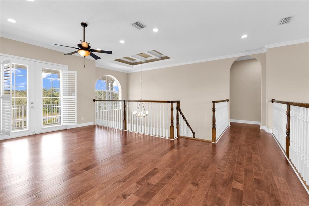 5595 Riverside Drive Punta Gorda, FL 33982 - Photo 41 of 78 a view of empty room with wooden floor and fan