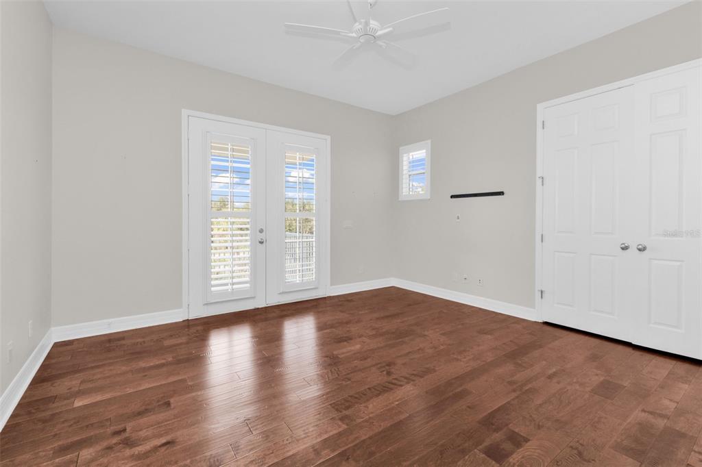 5595 Riverside Drive Punta Gorda, FL 33982 - Photo 43 of 78 a view of an empty room with wooden floor and a window