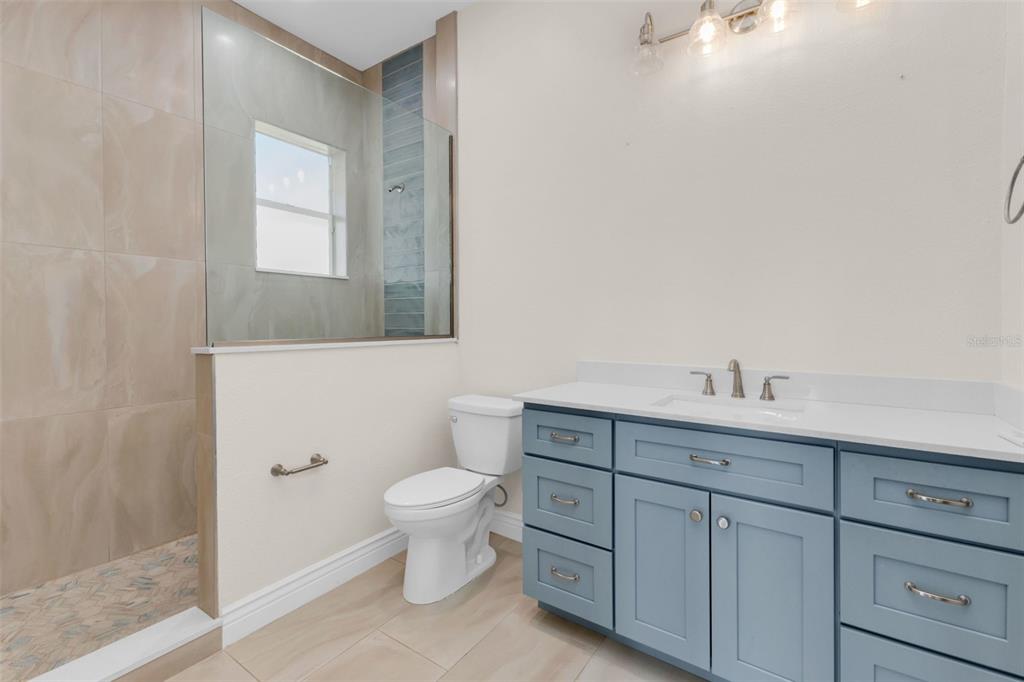 5595 Riverside Drive Punta Gorda, FL 33982 - Photo 45 of 78 a bathroom with a sink a toilet and mirror