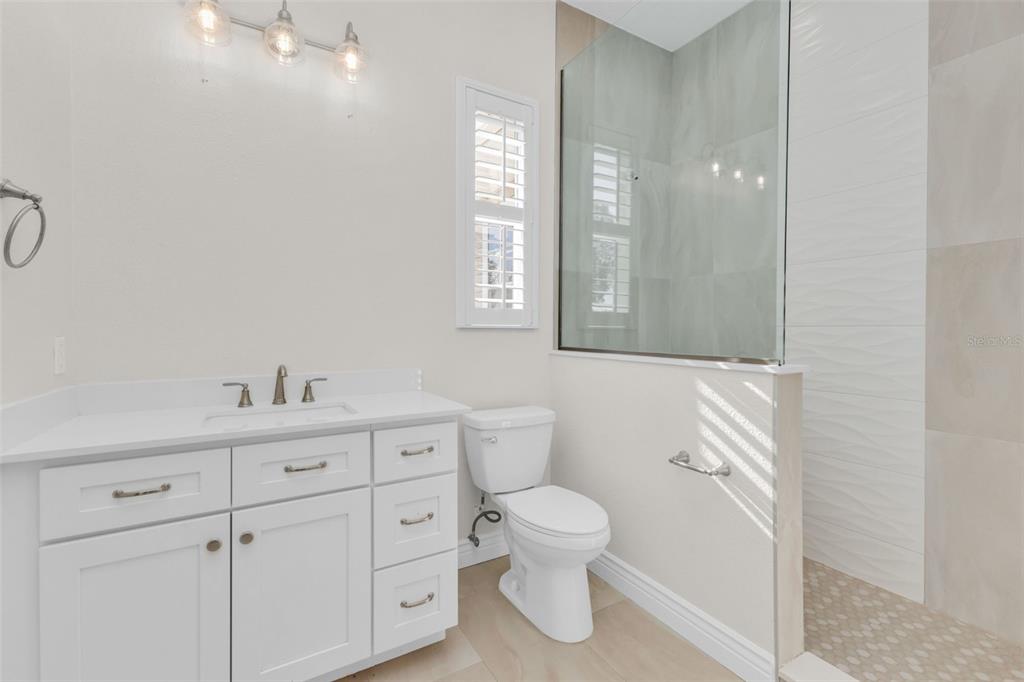 5595 Riverside Drive Punta Gorda, FL 33982 - Photo 49 of 78 a bathroom with a toilet sink and mirror