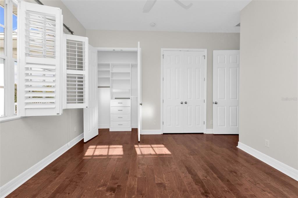 5595 Riverside Drive Punta Gorda, FL 33982 - Photo 51 of 78 a view of empty room with wooden floor and fan