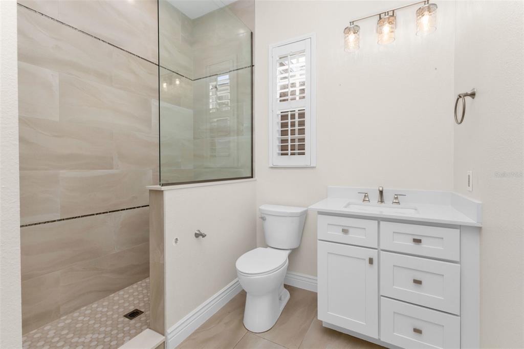 5595 Riverside Drive Punta Gorda, FL 33982 - Photo 52 of 78 a bathroom with a toilet a sink and a shower