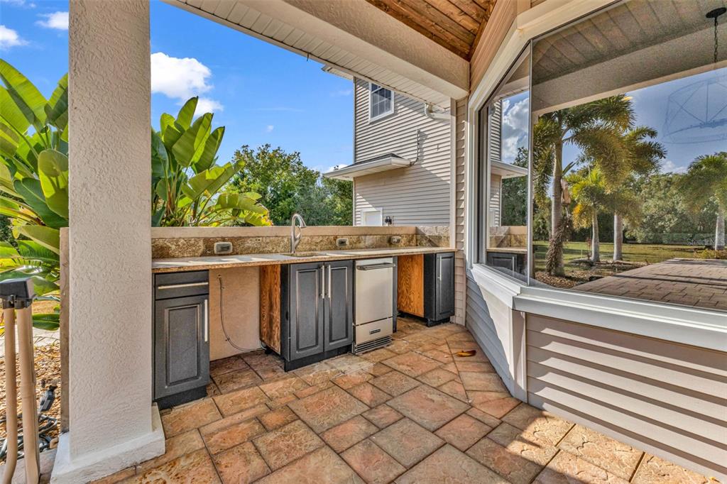5595 Riverside Drive Punta Gorda, FL 33982 - Photo 59 of 78 a view of a kitchen with a sink and cabinets