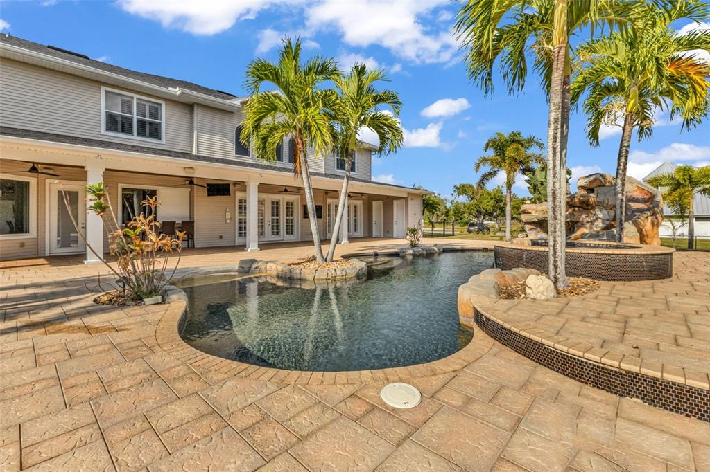 5595 Riverside Drive Punta Gorda, FL 33982 - Photo 73 of 78 a view of a house with swimming pool and sitting area