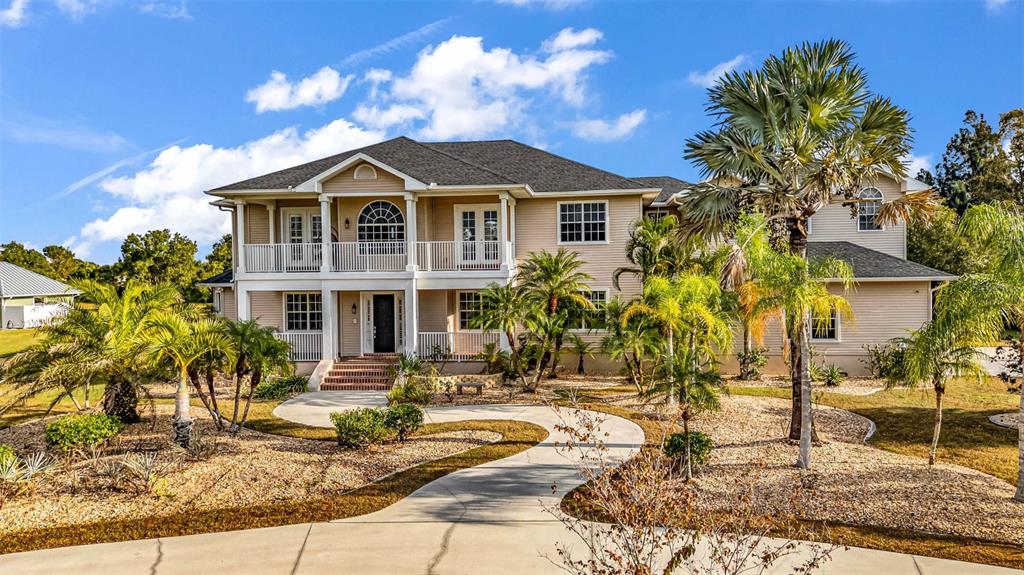 5595 Riverside Drive Punta Gorda, FL 33982 - Photo 76 of 78 a front view of a house with a yard