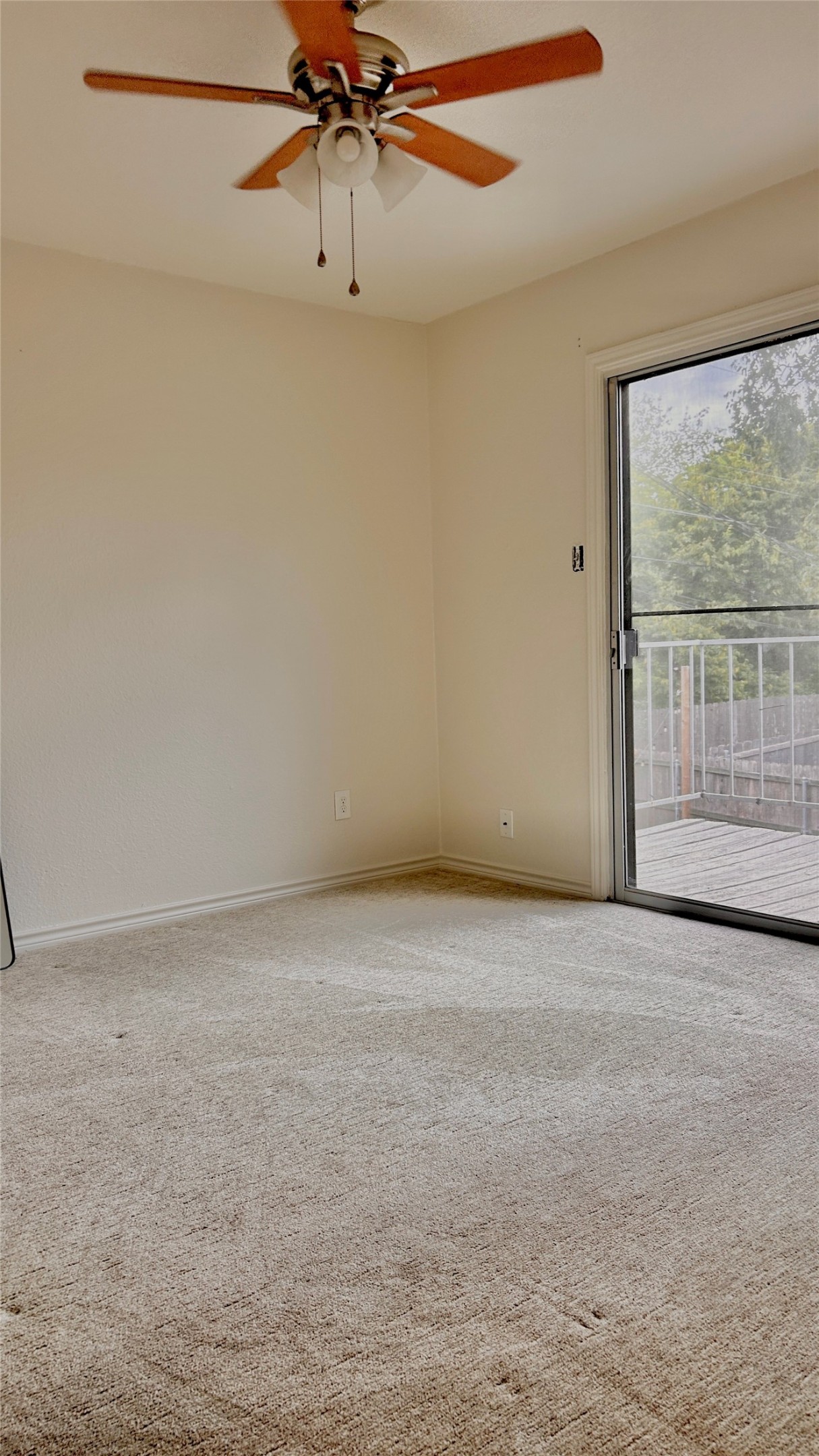 705 Castle Ridge Road, Unit C Austin, TX 78746 - Photo 11 of 15 Sliding glass doors open from this carpeted room directly onto a private elevated deck.