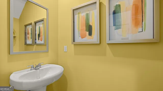 a room with cabinet a mirror and a glass door