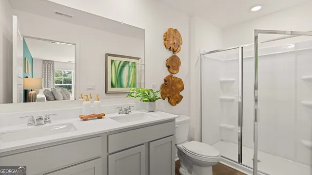 a bathroom with a shower a mirror and a toilet