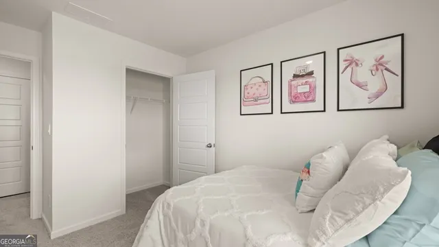 a bedroom with a bed and a dresser in it