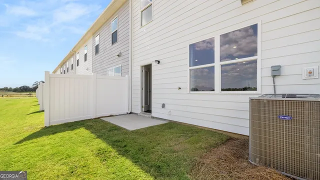 a view of house with yard