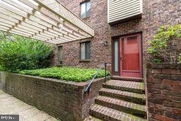 1204 Mountainview Drive Chesterbrook, PA 19087 - Photo 2 of 25 a front view of a house with a garden
