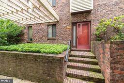 1204 Mountainview Drive Chesterbrook, PA 19087 - Photo 3 of 25 a front view of a house with a garden