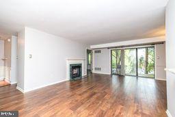 1204 Mountainview Drive Chesterbrook, PA 19087 - Photo 7 of 25 a view of an empty room with wooden floor and a window