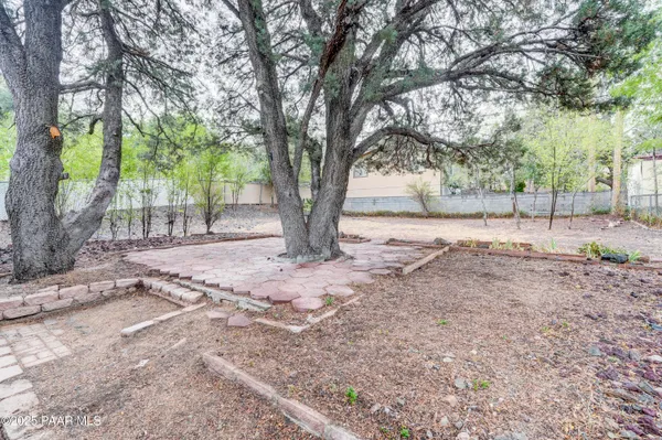 a view of a yard with a tree