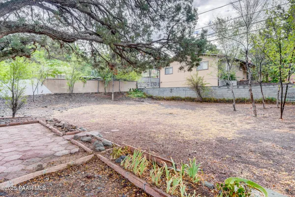 a backyard of a house with lots of green space
