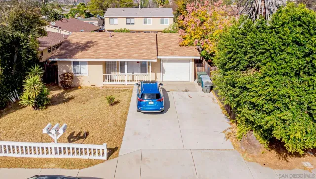 a view of a porch with a table and chairs