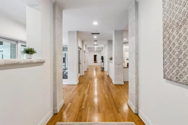 a dining room with furniture wooden floor and a chandelier