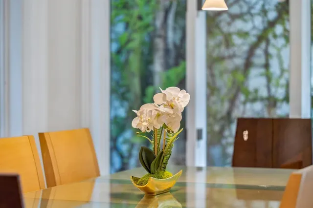 a bathroom with a granite countertop sink a mirror and a shower