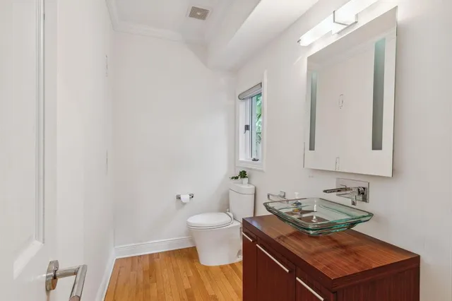 a spacious bathroom with a granite countertop sink mirror and a shower