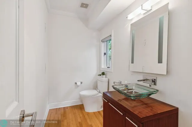 a bed room with a bed mirror and a window