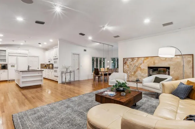 a living room with furniture rug and wooden floor