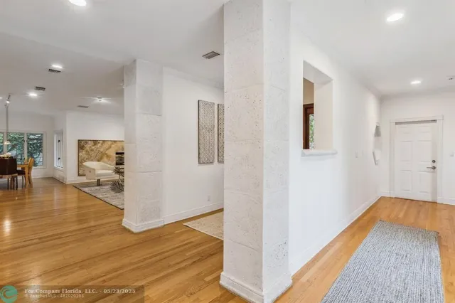 a bathroom with a granite countertop sink a mirror and a shower