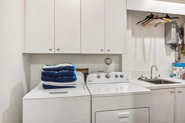 a bedroom with a large bed and a couch