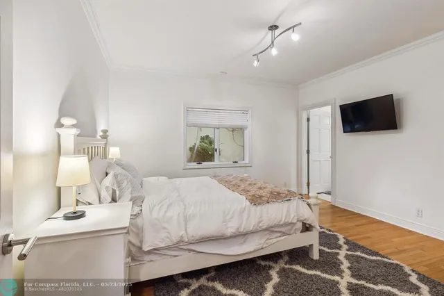 a living room with furniture rug and wooden floor