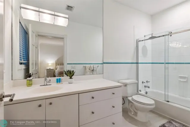 a living room with furniture a wooden floor and a fireplace