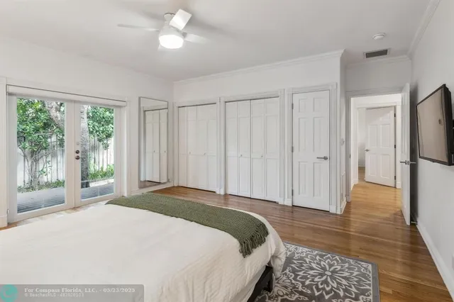 a spacious bedroom with a large bed and a large window