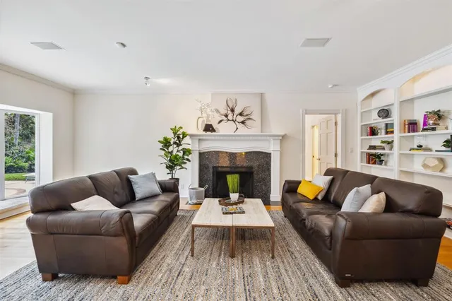 an aerial view of a house with swimming pool and porch